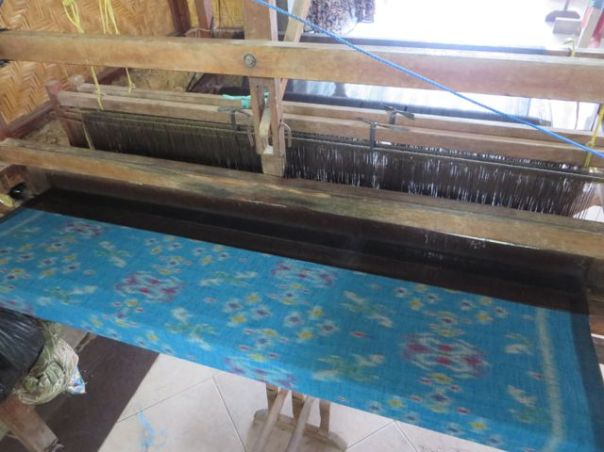 Weaving on the loom at the Batik Factory, Ubud.