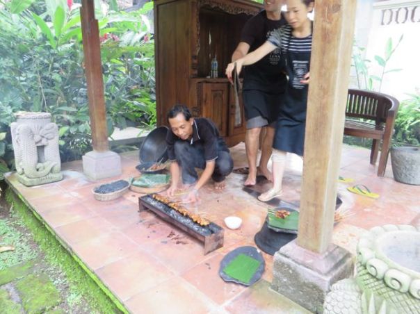 Grilling the chicken satay