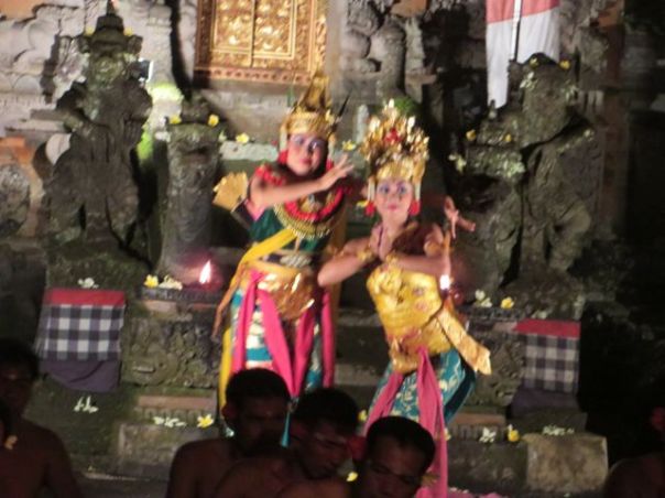 The women in full costume, dancing the story..