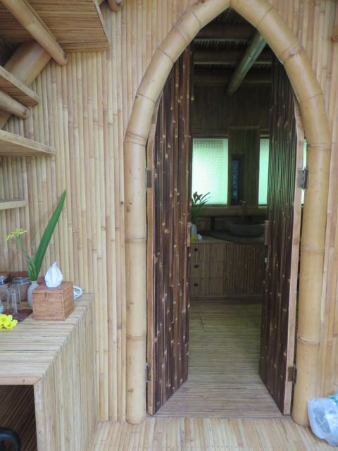 Behind the bed is the bathroom and symmetrical steps leading up to the loft.