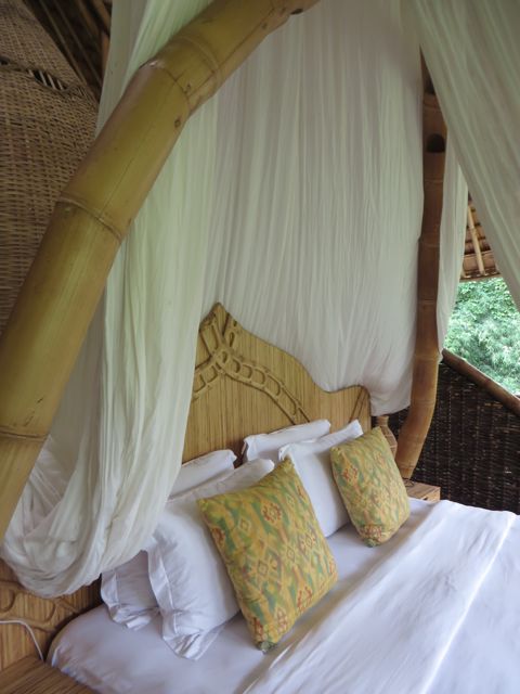 This bed has built-in air conditioning - the vents are in the bent bamboo above the headboard.