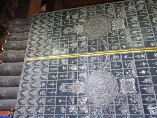 The bottoms of his feet with inlaid mother-of-pearl