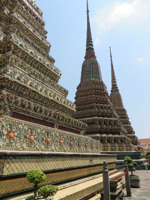 Each chedi is detailed in a different color mosaic.  