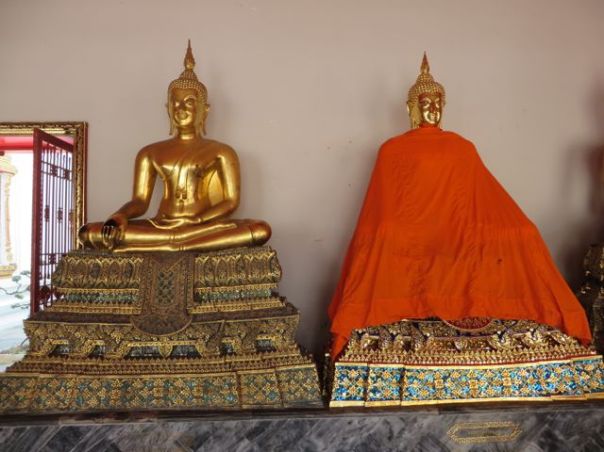 They cover the black part of the buddha while it is being cleaned.