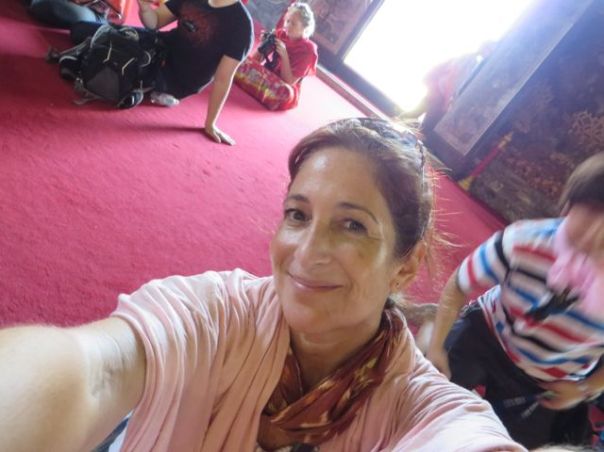 Me, sweating, and kneeling on the carpet for the buddhas.